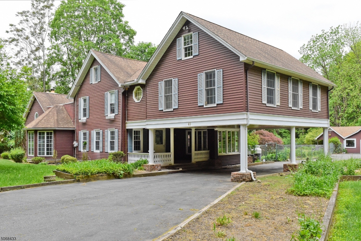 Welcome to 41 Old Boonton Rd. This colonial homes offers 4 bedrooms, 5 1/2 baths on a level lot with 1.032 acres of land. In ground pool. 3 garages and a cabana. It has lots of old world charm. Two fireplaces, wood parquet floors huge dining room, kitchen, living room and the upstairs has 2 master suites. One with an additional loft space that can be used as an office. Three huge detached garages. This home has lots of potential.
