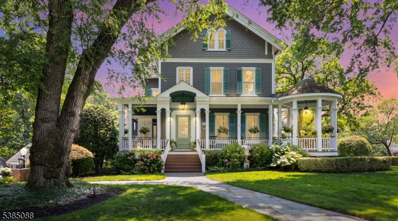 The Westfield Victorian you have been waiting for! Welcome to one of Westfield's most iconic Victorian residences, perfectly set on lush, landscaped grounds located just moments from the award-winning Downtown. This architectural gem seamlessly marries timeless Victorian grandeur with the finest modern luxuries, creating an elegant yet inviting atmosphere throughout. Step inside to discover a spectacular, oversized living room graced with a decorative mantel, gas fireplace, and soaring 10-foot ceilings. The formal dining room, complete with French doors, opens gracefully to a charming screened-in porch The recently renovated kitchen has been crafted to perfection with brand-new custom cabinetry, a dramatic center island, a suite of state-of-the-art appliances, and a refinished walk-in pantry. The next level is anchored by a private primary suite, offering a serene retreat equipped with a brand new spa like bathroom. Three additional bedrooms, a corner laundry room and a beautifully updated hallway bathroom complete this floor. The top level features three more versatile bedrooms ideal as guest rooms or home offices along with another full bath.The finished ground level is equally impressive, boasting a spacious walk-out family room with fireplace, custom wine cellar, and French doors that open to a stone patio. Crowning this exquisite home is the timeless wraparound porch an iconic Victorian hallmark offering panoramic views of the lush neighborhood.