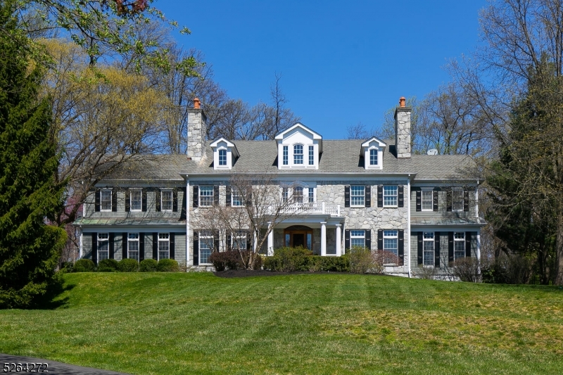 This exquisite colonial exudes sophistication & tranquility.Nestled on a sprawling 2+ acre lot in one of Basking Ridge's most elegant neighborhoods, this property offers breathtaking views & a level backyard adorned with a paver patio and resort-style pool. Meticulous attention to detail becomes evident, earning the prestigious "Best Custom Home of The Year" accolade from the NJ Builders Assoc. The custom kitchen is a culinary haven, featuring a generous island, marble countertops, dual sinks, top-of-the-line appliances, & eating area w/ view of the secluded backyard. 2 butler pantries seamlessly connect to the formal dining room, allowing for effortless entertaining. Custom office w/French doors provides a refined workspace. The home's luxurious ambiance is accentuated by 10-foot ceilings, 3 fireplaces, and hardwood floors throughout. The first-floor bedr with en-suite bath adds a delightful touch. The second floor has an additional 5 bdrs, incl. a primary suite w/sitting room, spa-like bathroom, & stunning boutique style walk-in closet. The finished basement, adorned with daylight windows, offers an additional full bathroom, home theater & abundant recreational space.RECENT ENHANCEMENTS, REPLACED SEPTIC (2023), new driveway lined w/ Belgian Blocks (2023), 2 HVAC units(2023), UPDATED BATHROOMS (2023),Home Theater (2023) & so much more.Conveniently located near shopping, commuter rails, & highways, this home is part of the award-winning Basking Ridge School District.
