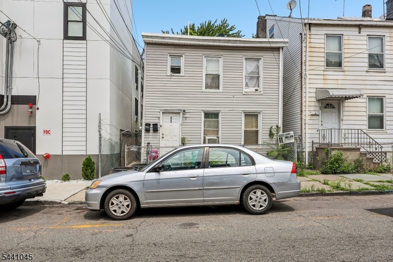 Don't miss this well-maintained 7 bedroom, 3 bathroom multifamily investment opportunity generating $5,200/month in total rent with all tenants on month-to-month leases, giving you maximum flexibility whether you're an owner-occupant or pure investor. Ideally located just blocks from the train station, bus lines, schools, shopping, and dining. Updated in 2020, this property is perfectly positioned for an owner-occupant to live in part of the home while collecting rental income from the rest, or for an investor to keep it fully leased for strong cash flow from day one. The first floor features a comfortable living room, eat-in kitchen, 4 bedrooms, and a full bath, offering generous space and functionality. The second floor includes a living room, eat-in kitchen, 3 bedrooms, and a full bath. The finished basement adds valuable bonus living space, further enhancing the property's versatility and value. Practical layouts and thoughtful updates enhance everyday living throughout. Outside, the fully fenced backyard includes a patio ideal for outdoor dining and grilling. With flexible living spaces, a finished basement, $5,200/month in existing rental income, month-to-month tenancy flexibility, and a commuter-friendly location, this is an excellent opportunity to own a versatile multifamily property in a convenient neighborhood.