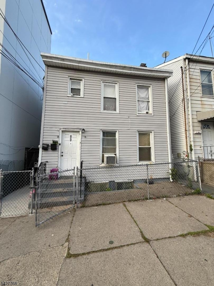 Don't miss this well-maintained 7 bedroom, 3 bathroom multifamily investment opportunity generating $5,200/month in total rent with all tenants on month-to-month leases, giving you maximum flexibility whether you're an owner-occupant or pure investor. Ideally located just blocks from the train station, bus lines, schools, shopping, and dining. Updated in 2020, this property is perfectly positioned for an owner-occupant to live in part of the home while collecting rental income from the rest, or for an investor to keep it fully leased for strong cash flow from day one. The first floor features a comfortable living room, eat-in kitchen, 4 bedrooms, and a full bath, offering generous space and functionality. The second floor includes a living room, eat-in kitchen, 3 bedrooms, and a full bath. The finished basement adds valuable bonus living space, further enhancing the property's versatility and value. Practical layouts and thoughtful updates enhance everyday living throughout. Outside, the fully fenced backyard includes a patio ideal for outdoor dining and grilling. With flexible living spaces, a finished basement, $5,200/month in existing rental income, month-to-month tenancy flexibility, and a commuter-friendly location, this is an excellent opportunity to own a versatile multifamily property in a convenient neighborhood.