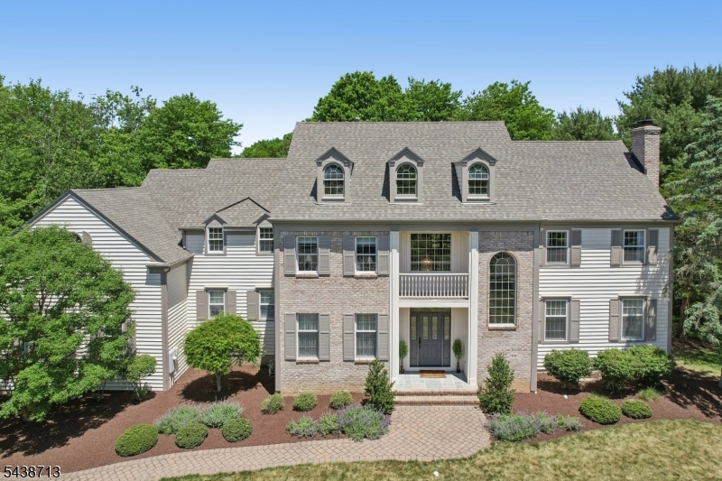 Welcome to 14 North Stone Hedge Dr, a beautifully designed one-owner home set on an impressive private property in the heart of Basking Ridge. Located on a quiet cul-de-sac street, this home offers a grand sense of space, natural light, and thoughtful design from the moment you enter the massive two-story foyer. The main level features a formal dining room with butler's pantry, spacious living room, family room, private office, and an incredible great room overlooking the expansive backyard. The large open eat-in kitchen flows perfectly for everyday living and entertaining, with access to a peaceful screened-in porch and wooded back patio. A huge three-car garage, whole-house generator, and exceptional curb appeal add to the home's convenience and presence. Upstairs offers four bedrooms, including a spacious primary suite with an en suite bath, jetted tub, and a beautiful walk-in closet with a new California Closet system. Two additional bedrooms share a Jack-and-Jill bath, while another bedroom features its own private bath. The second-floor laundry room adds everyday ease, and an unfinished upstairs room offers excellent potential to be converted into a fifth bedroom. The enormous basement provides a large rec room with plenty of additional potential. Set on a huge backyard with privacy, mature surroundings, and a truly special setting, this home offers space, character, and a rare opportunity in Bernards Township.
