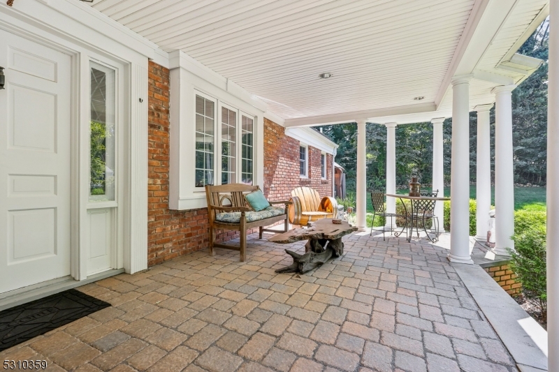 Welcome to this exceptional 6-bedroom, 3.5-bath raised ranch nestled on a picturesque builder's acre in a peaceful, park-like setting. Offering over 3,200 square feet of thoughtfully designed living space, this home perfectly blends comfort, luxury, and energy efficiency.A charming front porch provides the ideal spot to enjoy stunning sunsets, while the expansive side patio extends the living space outdoors. Inside, you'll find a spacious floor plan featuring a welcoming living room with custom built-ins and a wood-burning fireplace. The chef's kitchen combines style and functionality, making it perfect for everyday living and entertaining.The ground level features a private in-law suite with its own entrance, living room, full kitchen, fireplace, and private patio with a fire pit ideal for in law suite.Additional highlights include an attached 2.5-car garage and a detached 20' x 24' garage with loft, built in 2018 and equipped with 100-amp electric service. Relax in the hot tub and enjoy the beautifully designed outdoor spaces that enhance the property's serene atmosphere.A major bonus is the fully owned solar energy system with battery backup and power storage, delivering energy independence and over 80% savings on electric costs. Meticulously maintained and thoughtfully updated, this remarkable home offers a rare opportunity to enjoy flexible living, modern efficiency, and timeless appeal in a truly tranquil setting.