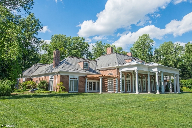 A rare opportunity awaits to own the distinctive New Vernon estate Nine Arches. The original home nestled on over 10 acres of bucolic landscape was designed by architect Ike Coburn. In 2012, extensive renovations and the addition of a 2nd floor brought  this property to new prominence. Breathtaking marble foyer, exposed brick, herringbone wood floors & beautiful finishing trim work thru-out. Gourmet kitchen boasts two of seven frpls & expansive dining area, formal DR adorned w/Italian Murano glass fixtures, a 2,000-bottle wine rm is also featured on the 1st flr. The new 2nd flr provides flexibility with a bedroom, sitting areas w/frpls, bonus rm, two full bths & laundry. Circular drive, front courtyard with bluestone walkway & fountain, a rear covered patio w/Corinthian columns & Pugliese pool.