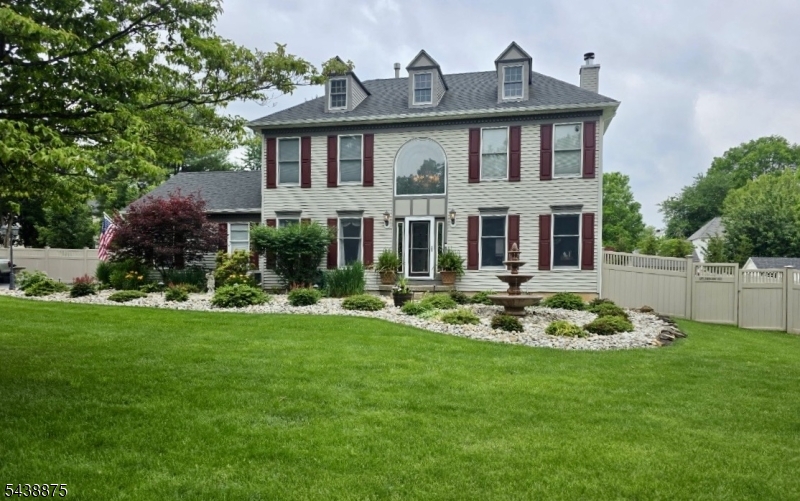 Welcome to this beautifully maintained 5-bedroom Colonial nestled on a level half-acre lot in desirable Fairway Estates. This spacious home offers an open and functional layout featuring a dramatic cathedral-ceiling foyer, eat-in kitchen, formal dining room and family room. The primary suite includes a full bath, stall shower, and walk-in closet. Enjoy year-round entertaining with a private backyard oasis complete with hot tub, gazebo, patio, underground sprinklers, and vinyl privacy fencing. Additional highlights include a finished basement with recreation space, two-car attached garage, public utilities, natural gas, and a prime location close to major commuting routes, shopping, and schools. Professional photos coming soon
