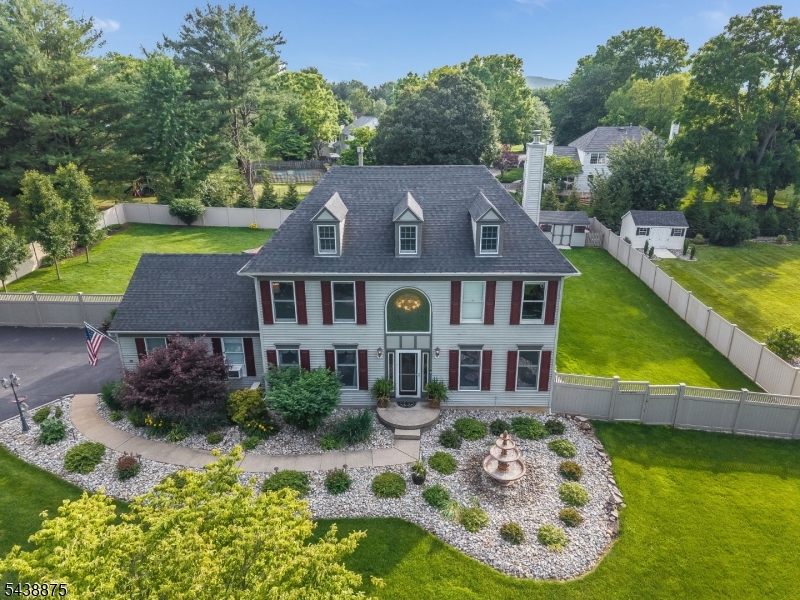 Welcome to this beautifully maintained 5-bedroom Colonial nestled on a level half-acre lot in desirable Fairway Estates. This spacious home offers an open and functional layout featuring a dramatic cathedral-ceiling foyer, eat-in kitchen, formal dining room and family room. The primary suite includes a full bath, stall shower, and walk-in closet. Enjoy year-round entertaining with a private backyard oasis complete with hot tub, gazebo, patio, underground sprinklers, and vinyl privacy fencing. Additional highlights include a finished basement with recreation space, two-car attached garage, public utilities, natural gas, and a prime location close to major commuting routes, shopping, and schools. Professional photos coming soon