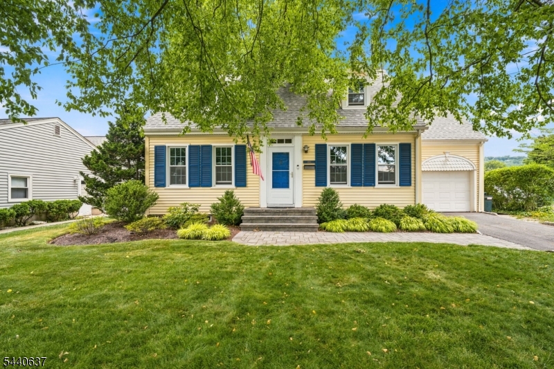 Welcome home to this charming Cape Cod nestled in North Plainfield, where classic meets everyday comfort. Offering 3 bedrooms and 2.1 bathrooms, this warm and inviting home provides the perfect blend of functionality and timeless appeal. The welcoming living room is anchored by a cozy fireplace, creating an ideal space for relaxing evenings. Just beyond, a sun-filled 3-season room that overlooks the backyard and opens directly to the deck, creating a seamless flow between indoor and outdoor living. The formal dining room offers an elegant setting for dinner or special occasions. At the heart of the home, the eat-in kitchen features granite countertops, white cabinetry, and a bright breakfast nook. The second floor offers three spacious bedrooms, a full hall bathroom, and a versatile bonus sitting room that can easily serve as a reading nook, home office, or additional living space. The basement adds even more room to enjoy, featuring a recreation room with a second fireplace and endless possibilities for entertaining, working from home, exercising, or playing. Outside, the private fenced backyard is designed for relaxation and entertaining alike. A newer TREX deck and patio provide the perfect setting for summer barbecues, outdoor dining, or simply enjoying the peaceful surroundings. Conveniently located near parks, shopping, and major commuter routes, this delightful Cape Cod offers the perfect combination of charm, space, and convenience.