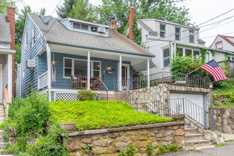Wonderful 3 bedroom cottage with deeded lake rights and views of the lake from your front porch. Generously sized living room, dining room, kitchen and small den/office on the first floor. 3 bedrooms and a full bath upstairs. The property includes two separate lots with a barn and additional parking for your use. Lots of potential!