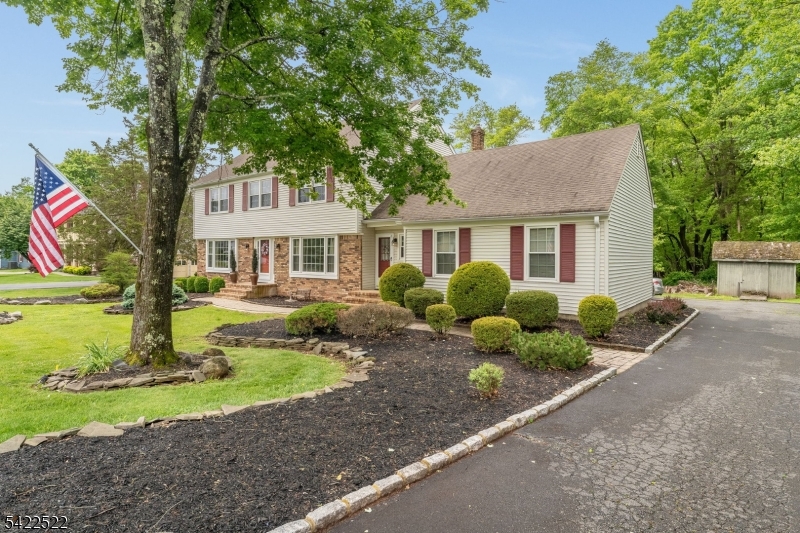 You'll love coming home to this beautifully updated colonial in desirable Wellington Heights, complete with a heated in-ground free-form pool, jacuzzi, and charming gazebo. The fully fenced backyard oasis includes a newer composite deck, pool shed (all pool equipment is included) and storage shed. The gourmet kitchen showcases quartz countertops, tile flooring and backsplash, stainless steel appliances, and a center island with pendant lighting and an undermount sink. A spacious formal living room opens to a huge step-down family room featuring a stone hearth, wood stove, and wet bar, with sliders from both the family room and breakfast area leading to a newer composite deck. Hardwood floors and abundant natural light enhance the home throughout. Convenience abounds with a first-floor laundry room and a large second-floor bonus storage room, and 2 walk-in closets. Recent updates include tilt-in Pella thermopane windows, upgraded electrical, a whole-house fan, 2 skylites (1 with remote) and ceiling fans in every bedroom. The primary bedroom has a large walk-in closet and primary bath offers a large stall shower and double vanity. PUBLIC WATER & SEWER. Parking for 9+ cars in the driveway! Oversized garage. This home blends spaciousness, comfort, style, and functionality perfect for entertaining and truly move-in ready. Don't miss it!