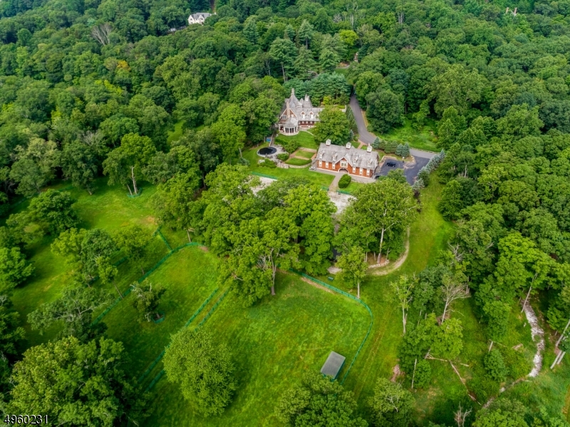 23+ acre horsefarm along the picturesque Ramapo River. The Greenwich architectural firm of Shope, Reno and Wharton created a stone and shingle style masterpiece which was built by James Nigro with no expense spared. The views are breathtaking and extraordinary. The 9 stall barn opens to a limestone jumping area, expansive paddocks and trails along the river. Above the stalls is a massive artists' loft with separate living quarters encompassing 3 bedrooms and 2.5 baths. Infinity pool, hot tub, stone BBQ, generator and so much more making this a once in a lifetime opportunity. Additional 1.2 acres with 2 antique homes available to purchase for $895,000.