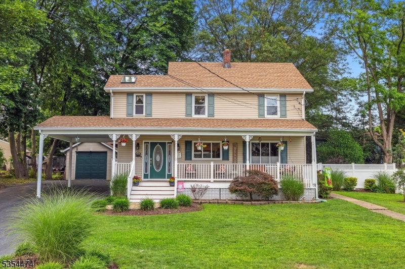 Extremely well maintained and beautifully updated colonial offers charm and character!  Highlights include kitchen with hardwood flooring, oak cabinets, gas range, microwave and granite countertops.  Dining room is light and bright with sliders to deck in private, fenced backyard and is open to family room/den area with hardwood flooring.  Formal living room has wood flooring and recessed lighting.  Upper level offers primary suite with sitting area, huge double closet and full bath with stall shower and laundry.  3 additional spacious bedrooms and full bath complete the 2nd floor.  Walk-up attic for additional storage as well as unfinished basement.  Other highlights include 2 car wide paved driveway, 1 car attached carport, 1 car detached garage, low maintenance vinyl exterior, rocking chair front porch,  storage shed, speakers throughout 1st floor and porch, thermal pane windows, split unit and central air, gutter guards, water heater 5 years, roof 6 years, deck awning as-is - can be opened manually.  Minutes to Rts. 46 and 80, excellent Denville schools!  NOT a flood zone.