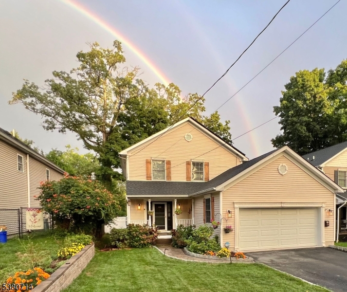Welcome to this beautifully maintained 4-bedroom, 2.5-bath Colonial nestled in one of Boonton's most sought-after neighborhoods.The main level boasts a large kitchen with abundant oak cabinetry, center island, and breakfast bar that opens seamlessly to the inviting family room with gleaming hardwood floors and a cozy gas fireplace. A sliding glass door leads to a low-maintenance composite deck with a retractable awning, perfect for outdoor entertaining. The main floor also features a formal dining room with hardwood floors and a convenient powder room.Upstairs, you'll find a spacious primary suite with a full bath and double closet, plus three additional bedrooms with ample closet space and another full bath.The partially finished basement provides versatile space for a home office, gym, or recreation room, along with plenty of storage.Recent updates New Hardwood floors on 1 st floor, newer roof, renovated kitchen and bathrooms, New fence, newer hot water heater, Whole house Portable Generator Hookup. ensuring peace of mind for years to come. ( Surveillance camera in service )