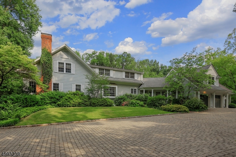 Spectacular home on over 4.5 acres of fabulous grounds featuring an in-ground, salt water, heated pool, tennis court & pond. This magnificent home offers an open floor plan, spacious rooms, high ceilings &custom moldings throughout. Some highlights on the 1st floor incl a gorgeous center island EIK w/separate dining area, a stunning Great Room w/addl seating area overlooking the amazing property, a handsome office & exquisite living room, each with,fireplace.  The 2nd floor offers a MBR suite w/dual closets & luxurious private bath, 3 addl BRs & 3 addl full baths. LL gym, powder room & large laundry room. Set on spectacular grounds w/a gated entry, open porches, patio & 2 car attached garage, this special home offers amazing space, both indoors & out, perfect for living, dining and entertaining!