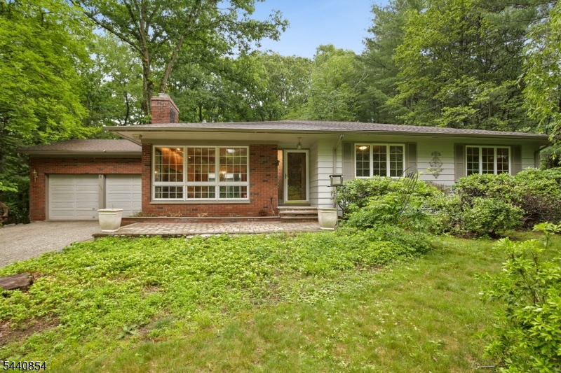 ONE-OF-A-KIND VINTAGE RANCH ON OVER AN ACRE IS A UNICORN WAITING FOR SMART BUYER! Beloved home to a cherished local landscaper for over 50 years, the sprawling, lush green property is the first thing you'll notice after you pull into the 110-ft driveway past the babbling stream. Fenced-in flat Backyard is surrounded by tall shade trees, raised beds & expansive wood deck. Birdsong is the only thing you hear & nature is the only thing you see! Of several outbuildings, a large workshop/shed w/ electric serves every hobbyist's need. Inside, enjoy an easy flow with open Living Room w/ big picture window & WB brick fireplace opening into Dining Room w/ original hardwood floors. Amazing Florida Room w/ slate floor is bathed in natural light w/ windows on 3 sides & new skylights. Cozy Kitchen is inviting & practical w/ pot-belly stove, warm wood cabinetry, Breakfast Nook in front of sliders to deck & Powder Room. Three Bedrooms & 2 Full Baths are steps away. Primary Ensuite includes walk-in closet & sliders to the back deck, a perfect spot for morning coffee. Head downstairs for retro fun w/ a finished Rec Room & large Bar built for entertaining, but hold the Bonus Room as your secret showpiece. It has Laundry & tons of cabinetry, so could easily convert to craft, work or exercise room. Brand new roof. Do not miss your chance to see this!