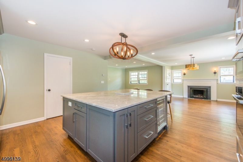 Enjoy all the advantages of 1 floor living + a full finished basement. The amount of flexible living space is impressive. Lovely, private, backyard backed against protected Park Land. Patio-Walkout from bsmt. Perfect for entertaining. Gleaming HW floors throughout. 3 comfortable bdrms plus bonus attic space. Lots of additional room to fit your lifestyle. Renovated eat-in-kitchen w/gourmet Bosch appliances, soft close cabinets & oversized center island opens to formal DR & bright open LR. Finished basement adds to its spaciousness & organization. 1 car garage, plenty of parking. All located in a welcoming neighborhood on Dead End street. Easy access to NYC-Direct train station, shopping, parks. Easy access to highways, mass transit & top rated schools.