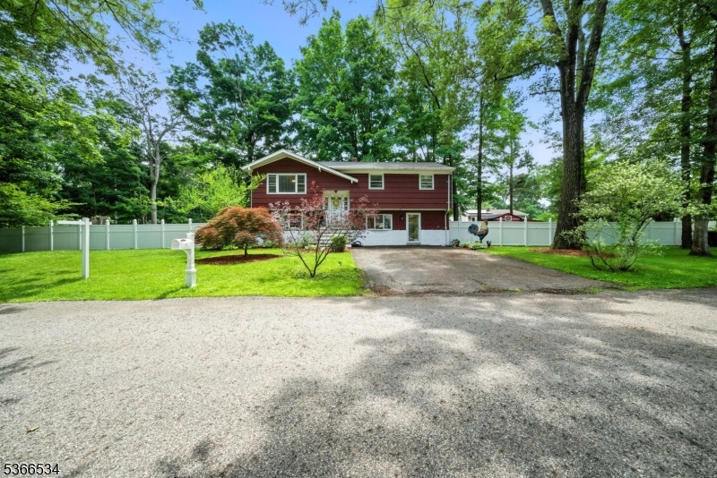 Welcome to Greenbrook Estates in West Milford! This 4-bedroom, 2-bath bi-level sits on a desirable corner lot and offers peace, privacy, and year-round access to Greenwood Lake without the lakefront price tag. Enjoy a new roof (2022), new boiler (2021), public water, and natural gas. The upper level features hardwood floors, a living room, dining area with deck access, kitchen (deep freezer included), three bedrooms, and a full bath. The lower level has a no-step entrance, a large family room, rec room, fourth bedroom (currently used as a gym), full bath, laundry room, and sliders to a fully fenced backyard with both a deck and patio perfect for entertaining.  Lake access is just a short walk away, and the seller has already paid for the first year of dock access. Community amenities include a pool and park. Conveniently located near NYC transit, shopping, dining, and outdoor recreation.  Don't miss this hidden gem! ** Per Sellers: H&B is due by Tuesday July 15th 5pm**