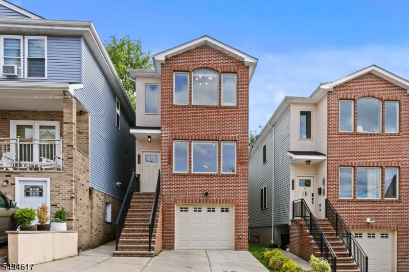 Experience modern living in this stunning newer-construction single-family triplex located in one of the most desirable areas of North Bergen. This beautiful home features three spacious levels with elegant hardwood floors throughout, HVAC. It is smart home. The main level offers a bright open-concept layout seamlessly connecting the living room, dining area, modern kitchen, and eat-in kitchen space or Family Room. It is perfect for both everyday living and entertaining. Plus a half bath. The second floor features 4 generously sized bedrooms, two full bathrooms, including a luxurious primary suite. The ground level offers a fully finished above-grade basement with a spectacular family room, ideal for entertainment, recreation, or additional living space with a 2nd half bath. A tandem two-car garage with electric vehicle charging capability adds convenience and modern functionality. This home also includes sleek modern appliances and contemporary finishes throughout. Perfectly located just 20 minutes from Manhattan and only 10 minutes from American Dream Mall, with easy access to shopping, dining, transportation, and everything you may need for an effortless commute to New York City.A rare opportunity to own a modern home in an unbeatable location.