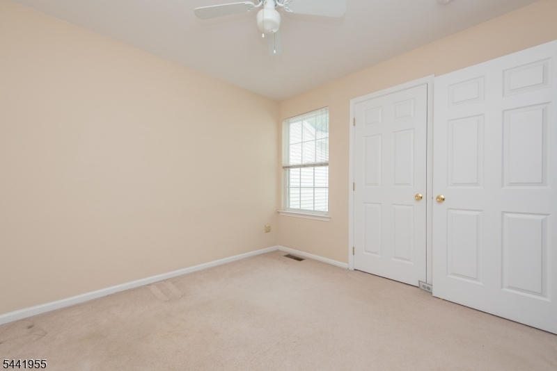 Welcome to Berkshire Hills, one of Denville's most desirable townhome communities. This spacious 3 bedroom, 2.5 bath townhome with a finished walkout basement and 2 car garage offers a wonderful opportunity to personalize a home to your own style and taste. Well maintained and featuring largely original finishes, this home is ready for its next owner to make it their own. The sun-filled main level offers an open floor plan with a seamless flow between the kitchen, dining area, and living room, making everyday living and entertaining easy. Sliding glass doors lead to a private deck, and a powder room and direct access to the garage complete the 1st floor. Upstairs, you'll find 3 generously sized bedrooms, a full hall bath, and a laundry area. The spacious primary suite features a large walk-in closet and bath. The finished walkout basement provides valuable additional living space, ideal for a family room, home office, gym, recreation room, or guest area, with access to a 2nd outdoor deck. New this year garage door and stove. Enjoy Berkshire Hills amenities, including a pool and playground. Ideally located in the heart of Denville, this home is just minutes from the vibrant downtown known for its local shops, restaurants, farmers market, and year-round community events. Conveniently situated near major highways, NJ Transit rail service, shopping, dining, entertainment, and highly regarded schools, this home offers an exceptional combination of space, location, and potential.