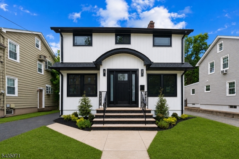Completely renovated from top to bottom, this stunning 3-bedroom, 2.5-bath home seamlessly blends modern style, quality craftsmanship, and everyday comfort. Thoughtfully redesigned with today's buyer in mind, the home features an open and inviting floor plan, wide-plank hardwood flooring, designer lighting, custom accent walls, and premium finishes throughout. The beautifully appointed kitchen serves as the heart of the home, showcasing quartz countertops, custom cabinetry, stainless steel appliances, and a center island ideal for gathering and entertaining. The spacious living area is highlighted by a striking fireplace feature wall, creating a warm and sophisticated focal point, while large windows fill the home with natural light. Upstairs, generously sized bedrooms provide comfortable accommodations, including a serene primary suite. The beautifully updated bathrooms feature custom tilework, contemporary fixtures, and spa-like finishes. The fully finished basement offers valuable additional living space, perfect for a recreation room, home office, gym, media room, or playroom. Every detail has been carefully curated, creating a truly move-in-ready home that offers the style and functionality today's buyers desire. Ideally situated in the heart of Nutley, this exceptional home is just moments from vibrant downtown shops and restaurants, beautiful parks, local favorites, and quick access to major highways and NYC transportation, making it the perfect place to call home.