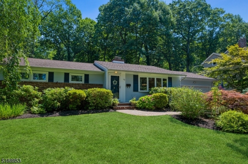 Impeccably renovated, superbly located!  Meticulously updated Ranch home with 3 bedrooms and 2 full bathrooms is packed with features and finishes you can see and feel. Set on a manicured lot on a tree-lined street, this home is near schools, stores, and restaurants with easy access to major highways and parks.  An extra-wide driveway to the attached two-car garage leads to a stone paver walkway and entry to the foyer. The open design interior features hardwood floors, lots of natural light, and a cool, neutral color palette. The sun-washed living room with a large bow window and a sleek wood burning fireplace flows to the formal dining room. The updated kitchen is bright and airy with granite counters, stainless steel appliances, beautiful cabinetry, and a cozy breakfast nook next to sliding glass doors. Outside, the large deck is perfect for warm weather entertaining as you look out on the lush back yard with mature shade trees.  The bedroom wing includes the large primary bedroom, two additional bedrooms, and a full hallway bathroom. The finished basement offers even more living space with a huge family room, a large recreation or office area, a full bathroom, laundry room, and plenty of storage.  All this plus, a Timberline GAF roof, and an in-ground Hydrotech sprinkler system, new driveway.  Ready to move in!
