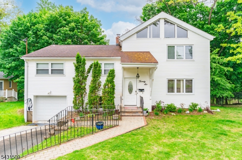 Welcome to 26 Cornell Street, a beautifully updated custom split-level in West Orange's coveted St. Cloud section. With over 2,700 square feet, 4 bedrooms, and 3 baths, this home pairs classic character with smart, modern upgrades. The layout flows effortlessly between everyday comfort and entertaining. Sun-filled living with the pool in the backyard, an updated kitchen built for both prep and gathering, and a natural transition to the backyard create a home that works as hard as it lives well. Upstairs, the oversized primary suite is a true retreat: vaulted ceilings, a private sitting area, walk-in closet, and spa-inspired bath. Outside, professionally landscaped grounds frame an in-ground pool and generous open space, striking the right balance of privacy and usability. Come turn this house into a home before someone else does