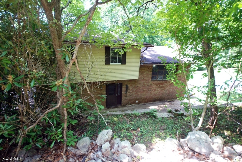 Welcome Home to this Private 3/4 Bedroom Bi-Level Nestled in Rural White Township! Set on Nearly 3.5 Wooded Acres! Open Floor Plan, Lots of Natural Light, Hardwood Floors, Custom Tiered Flower Beds made with Stone from the Property, Attached Garage, Storage Shed, and Ample Parking! Schedule Your Appointment Today! Minutes from Bucolic Mountain Lake, Restaurants, Wineries, Outdoor Amenities, and Major Roadways, Including Routes 31, 46, 519, & I-80. Sold As-Is.