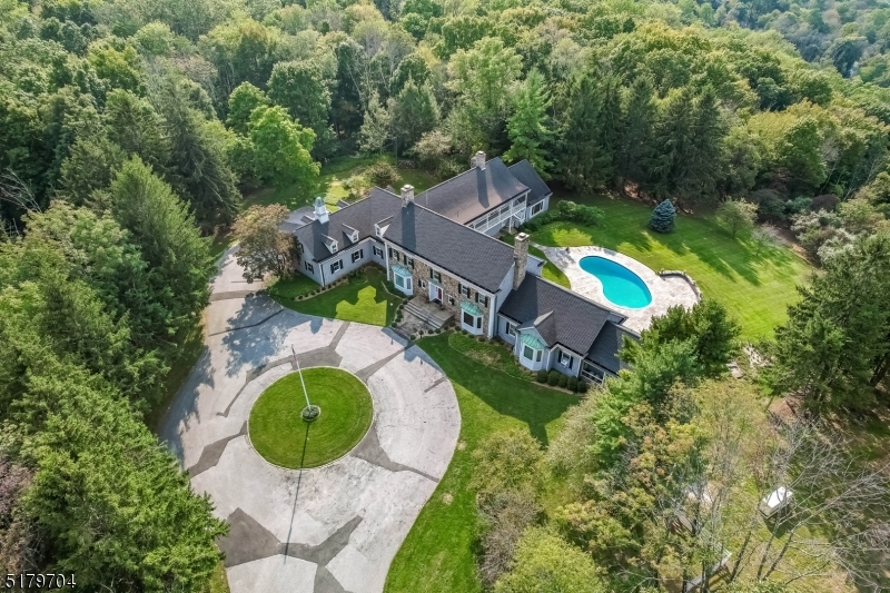 Welcome to this gorgoeus Georgian Estate located in Allamuchy.  This sprawling estate is situated on 182+ acres, offering unparalleled privacy and serenity from NJ's 2nd highest peak.  The almost 14,000 sq ft of living space features a Primary Suite on the main level with separate his/her Bath and Dressing areas, 4 additional Ensuite's on the 2nd floor, and a spacious Home Office. The elegant bay windows in the Family Room are perfectly complimented by the sweeping vistas of the Delaware Valley, while the spacious room with wet bar is the place to host your very own Fall colors viewing party!  Two large, wood burning fireplaces will keep you warm on those cold NJ nights.This gem is conveniently located w/in 50 mins of NYC and only 20 min from Morristown, Rockaway & Wharton areas. Relax in the recently renovated swimming pool, play a quick game of tennis on the court, or enjoy your membership at the Panther Valley Golf and Country Club. 27 Rutherfurd Rd, the Single family Home located at the entrance of the property, is currently rented and is included in the sale.
