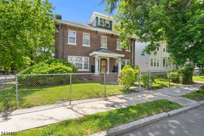 Classic charm, and endless potential in the highly sought-after Weequahic section of Newark. This stately brick Center Hall Colonial offers 4 spacious bedrooms, 2 full baths, and 2 half baths with oversized rooms, soaring ceilings, and timeless architectural character throughout. Features a finished basement, expansive pull-down attic space, detached two-car garage, private backyard, and ample parking. A new furnace has already been installed, providing a solid start for your vision. Being sold strictly as-is, this property is the perfect blank canvas for buyers looking to restore or customize a truly special home with incredible bones and classic appeal. Conveniently located near Downtown Newark, major highways, public transportation, and just minutes from the new Lionsgate Studios Newark development. Don't miss the opportunity to bring this historic beauty back to life in one of Newark's most desirable neighborhoods. This is an Estate sale please note
