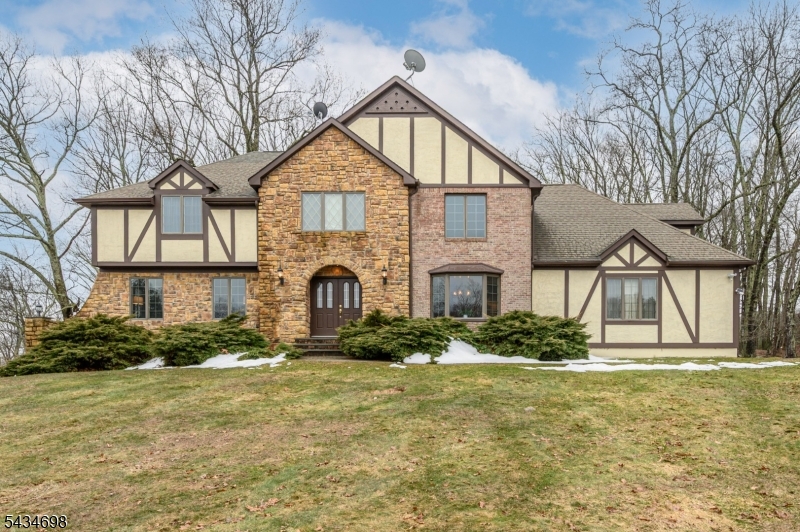 Stunning 4 Bed 2.5 Bath Colonial with Master Suite, 2 Car Garage & Full Basement in desirable Hardwick is sure to impress! Perfectly appointed on 3+ sprawling acres on a quiet cul-de-sac w/almost 3000sq ft of finished living, its the perfect place to settle & grow. Meticulously maintained inside & out with curb appeal with a newly painted exterior (2022) & 2 stone walkways, step in to find a spacious, sophisticated interior with generous room sizes, hardwood floors that shine & plenty of natural light all through. Foyer entry gives way to a light & bright living room + formal dining room that makes entertaining easy. Beautiful eat-in-kitchen offers newer sleek SS appliances, gorgeous granite counters, ample cabinet storage with underlighting, recessed lighting & sunsoaked dinette space. Rear family room holds a cozy pellet stove, built-ins & access to the large rear deck with new door (2021). Convenient 1/2 bath & laundry round out the main level. Upstairs, find the main full bath, versatile home office & all 4 generous bedrooms, inc the Master Suite. MBR BOAsts its own walk-in closet & ensuite bath with jacuzzi tub & stall shower. Finish off the basement for even more living space! Park-like backyard BOAsts a deck & plenty of yard space, partially fenced-in for your privacy & comfort. Double wide driveway offers ample parking. Central air, water softener & water filter sys. Close to parks, restaurants, convenience stores, a brewery & more!