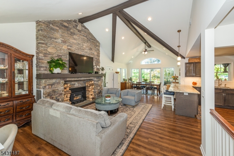 Character and charm meet modern comfort in this incredible custom ranch just moments from the heart of Lake Mohawk Plaza, local beaches, shops and restaurants. With its striking stone front, warmth and inviting curb appeal, this home offers the perfect blend of timeless design and easy living. Inside, the open floor plan is filled with natural light from oversized windows and features beautiful floors with a stunning oversized stone fireplace as the centerpiece of the main living area. Vaulted ceilings with beams. The dining space opens through sliders to a spacious deck with year round Lake Mohawk views, creating the ideal setting for morning coffee or evening entertaining. The main level includes a serene primary suite with his/hers closets and beautifully updated en-suite bath, plus an additional bedroom and full bath. The fully finished walkout lower level nearly doubles the living space and offers incredible flexibility with a spacious third bedroom, large family/rec room, office area, abundant storage and a third full bath. This desirable location is just a short stroll to The Plaza, this is lake living at its finest! Spend your days kayaking, paddle boarding, or fishing, and end them with pizza and a shake on the Boardwalk. Whether you're seeking a full time residence or a weekend escape, this home delivers. Enjoy all that Lake Mohawk has to offer, including private beaches, a clubhouse, scenic boardwalk, and the unique charm. Best and Final offers in by Friday 5pm.