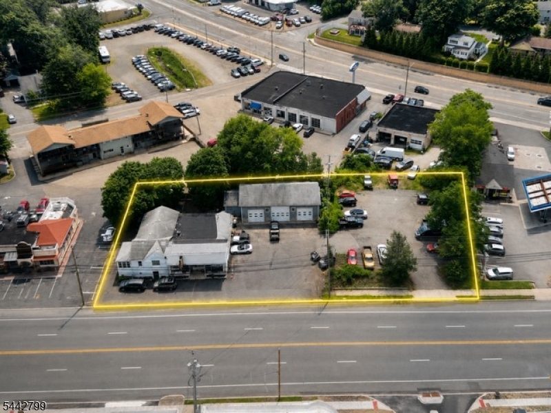 Prime Highway Commercial Opportunity " Endless Potential! Exceptional investment opportunity located on Route 46 in the heart of Netcong, offering outstanding visibility, accessibility, and exposure. Featuring two commercial lots, 0.64 of an acre. Approximately 250 feet of highway frontage and three state-approved entrances, this property provides endless possibilities in a desirable and growing commercial corridor. Conveniently located near major routes with excellent traffic exposure, this is an ideal opportunity for investors, owner-users, and developers.The property includes a versatile commercial building with a three-bay auto repair garage featuring 2 vehicle lifts, plus an additional 0.328-acre lot included in the sale. The additional lot offers excellent potential for parking, expansion, or construction of another building (subject to municipal approvals). The main property provides approximately 13-15 parking spaces, not including the additional lot.The storefront includes a one-bedroom living area with 1.5 baths and a private separate entrance, offering flexibility for owner occupancy, office space, employee accommodations, or other permitted uses. The lower level provides additional storage and utility space.Permitted Class B uses include retail stores, repair facilities, lodges, apartments, and many other approved uses. A complete list of permitted zoning uses is available in media.