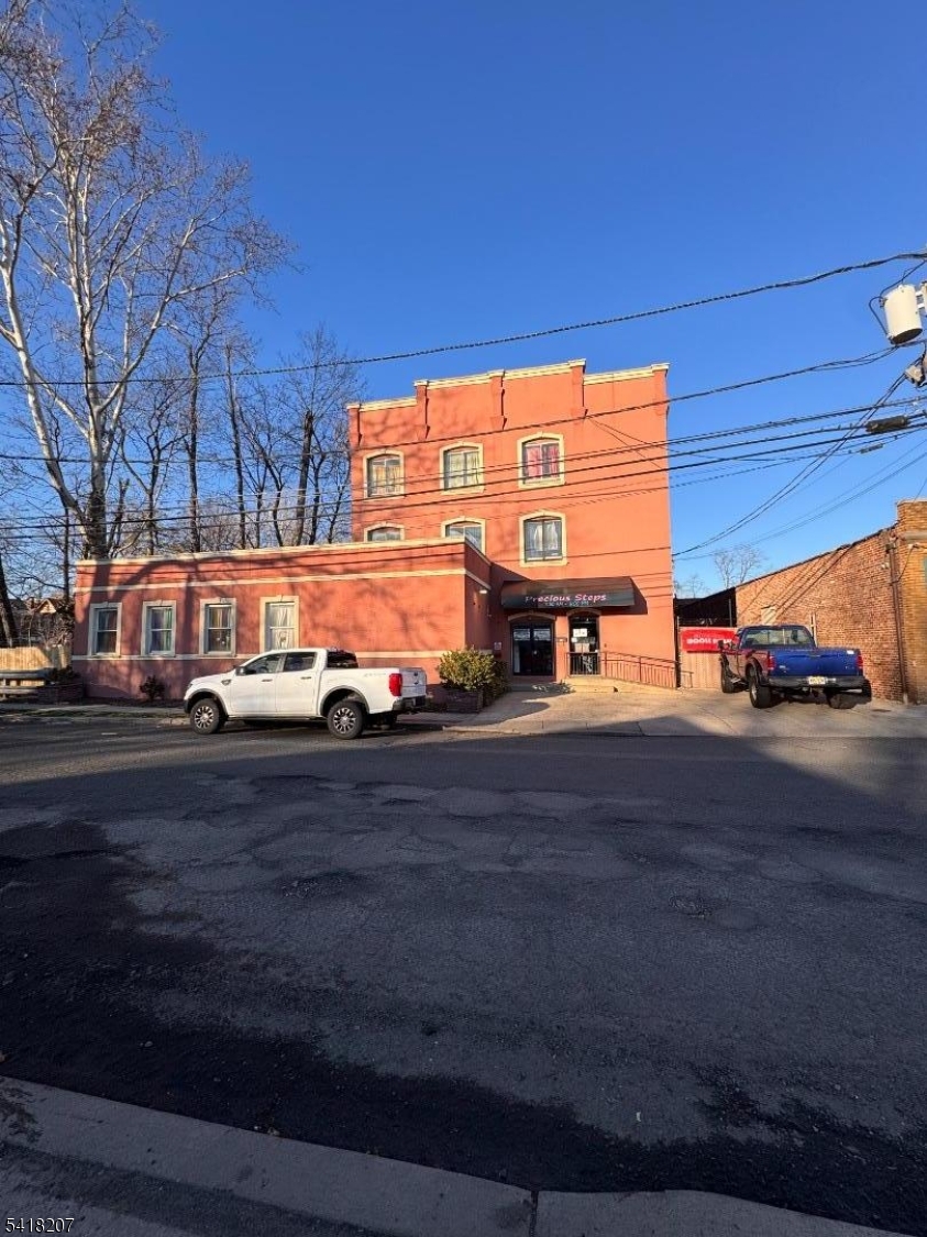 Exceptional mixed use investment redevelopment opportunity in the vibrant downtown district of Plainfield. Located at 12-18 Washington Ave Plainfield, NJ 07060 (Lots 9,16,17, & 18.) This property sits in a prime urban-suburban mixed use corridor with strong visibility and convenient access to local amenities and transportation. The property currently features multiple income-generating components, including an operating daycare, a warehouse space with a loading dock, a printing shop, a juice bar, and two apartments. The residential units consist of one spacious 2 bedroom two bath apartment and a 1 bedroom 1 bath apartment, offering rental income potential.A dedicated parking lot entrance from Washington Ave provides approximately six off-street parking spaces, adding valuable convenience for tenants and visitors. With its large combined lot size and prime downtown location, this property presents an outstanding opportunity investors, developers, or owner-users. The site is well suited for future redevelopment into a modern mixed use residential and commercial building, capitalizing on the continued growth and revitalization of the Plainfield downtown area. A rare chance to acquire a versatile property with existing income streams and significant long-term development potential.