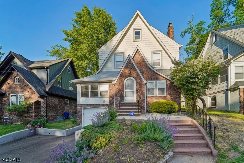 Nestled in the sought-after Upper Gregory neighborhood, this well-maintained Tudor offers character, comfort, and exciting potential. Enjoy convenient access to schools, parks, and the free Jitney service to the South Orange NJ Transit station. Inside, you'll find a spacious living room anchored by a charming fireplace, a large dining room for gatherings, an all-season den, breakfast area, and powder room. The second floor features three bedrooms and a full bath with both a separate shower and tub. The expansive walk-up attic presents endless possibilities create a primary suite, home office, guest space, or additional living area to suit your needs. Additional highlights include a brand-new indoor oil tank installed in May 2026. A wonderful opportunity to own a timeless Tudor and make it your own in one of the area's most desirable neighborhoods. Fireplace, chimney, grill, and gas line connection are being sold as-is. Fireplace and chimney inspections are for informational purposes only.