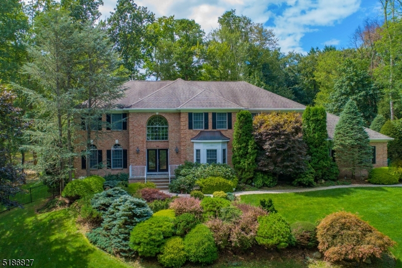 Grand brick Manor set on 1.24 acres of professionally landscaped property in stunning Stone Manor Estates. Enter through the custom doors to a dramatic 2 story foyer. The banquet sized dining room w custom molding is made for entertaining & the 2-story great room w floor to ceiling stone fireplace is the perfect space to relax. The custom eat in kitchen is open to the great room & features high end appliances, large island & granite countertops. The main floor bedroom is fitted with 36" doorways & full bath. A spacious living room & library complete the 1st floor. Upstairs the primary suite features tray ceilings, expansive closet space & a large bath. A 2nd bedroom w ensuite bath & 2 bedrooms w a 3rd full bath completes the 2nd floor. The full finished basement offers a large rec area w wet bar, gym, den & full bath. A resort-style backyard completes the property with saltwater pool, new Trex deck, open yard space & a full house generator.