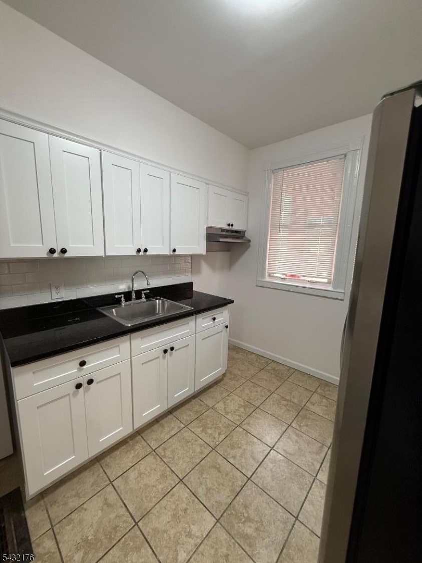 Completely renovated 3-bedroom home featuring a brand-new kitchen with granite countertops, subway tile backsplash, stainless steel refrigerator, and new grey Pergo flooring throughout. Freshly painted with an updated tiled bathroom, a freshly cleaned basement, a porch, and a small but charming yard. Includes new windows, doors, and window treatments. Centrally located near transportation, parks, and shops?this is a must-see!