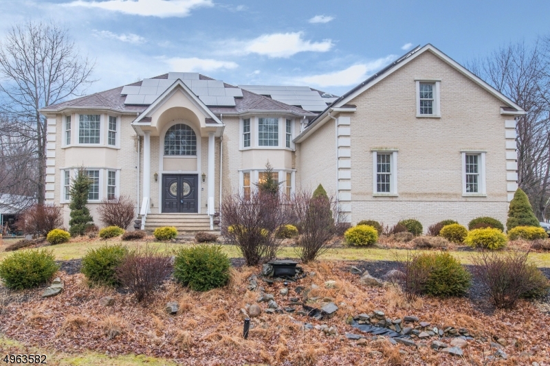 Stately Colonial, Understated Elegance! Bright, open floor plan. Beautifully decorated in neutral tones. Many stunning & unique features throughout. A showcase home! Luxurious stone foyer & elegant dual staircase welcome you in. This grand home is accented with cathedral ceilings, moldings & oversized windows. Updated kitchen w/ granite, cherry cabinets, stainless steel appliances & expansive center island. Gorgeous hardwood flooring throughout. Entertain with Flair! Chose 1 of 3 staircases to 2nd level. Master includes large bath w/6 jet full body shower, enormous walk-in closet & sitting area. 3 more spacious bdrms & attic. Tons of possibility in full, unfinished bsmt. The grandeur continues outside. Enjoy the outdoors on 2 tier paver patio & level yard. Close proximity to major hwys. Excellent Schools.