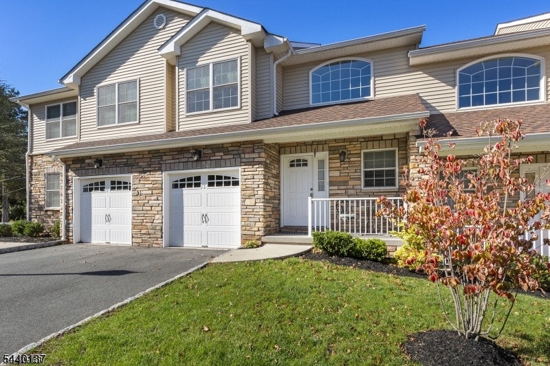 Spacious townhome located in the highly desirable Stone Hill Village community. Built in 2015, this 3-bedroom, 2.5-bath home offers an open floor plan, and a great location close to parks, shopping, and transportation. A charming front porch welcomes you into the impressive cathedral entrance foyer, The open-concept main level features hardwood floors, spacious living and dining areas, and a bright kitchen Sliding doors lead to a private deck and outdoor space. Upstairs, the spacious primary suite offers a private en-suite bathroom and generous closet space. Two additional bedrooms, a full hall bath, and the convenience of second-floor laundry. The full basement with high ceilings provides possibilities for future finishing, storage, a home gym, recreation room, or office space. Additional features include an attached one-car garage, driveway parking, guest parking, hardwood floors throughout, central air, and low-maintenance living. Ideally located near Oak Ridge Park, shopping, restaurants, major highways, and transportation, this home offers the perfect combination of comfort, convenience, and modern style.