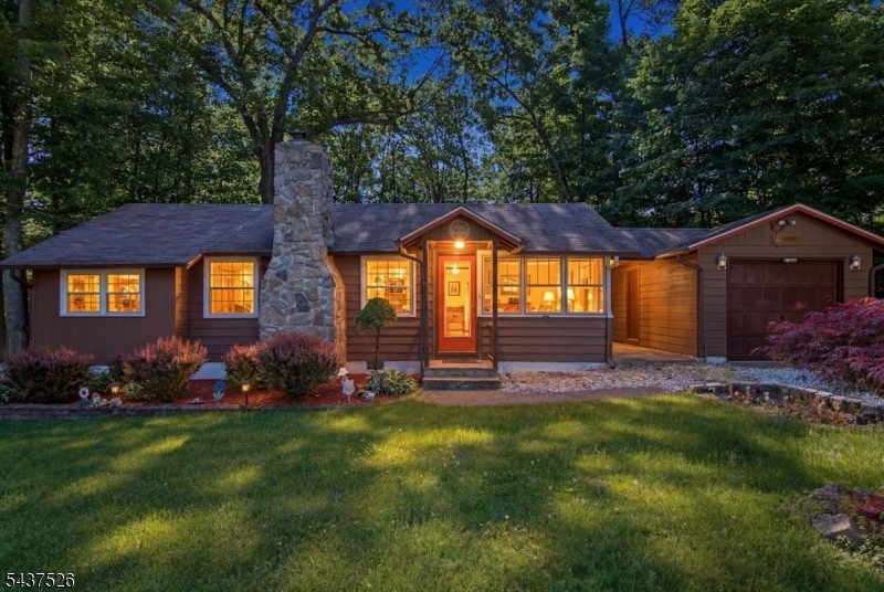 Welcome to this adorable year round ranch-style lake home!  Upon entering, you'll be greeted by a spacious entry foyer featuring sun-drenched windows, offering the perfect space for storage, a home office, or a cozy sitting area. Continue into the inviting living room, where a charming wood-burning stove creates a warm and welcoming atmosphere. This delightful home offers 3 comfortable bedrooms, kitchen with stainless steel appliances and  new stackable laundry units, a sun filled bonus room with a vaulted ceiling, creating an ideal space for a dining or family room for everyday living and entertaining.  Step outside to enjoy the privacy of a large double-lot backyard, perfect for relaxing, gardening, or hosting gatherings.  Additional features include two oversized driveways, a one-car garage, a large shed  with electricity and abundant storage, an instant tankless water heater, 500 ft deep well & 200-amp electrical service to accommodate modern living needs. Located in a highly desirable lake community, residents enjoy access to lakes, boat docks, beaches, a clubhouse with game rooms & ballroom facilities, and countless outdoor recreational opportunities including boating, fishing, hiking, skiing, and nearby water parks. Conveniently located close to the charming town of Warwick, this home offers the perfect blend of peaceful lake living and easy access to shopping, dining, and entertainment.  Don't miss your opportunity to own this wonderful lake retreat!