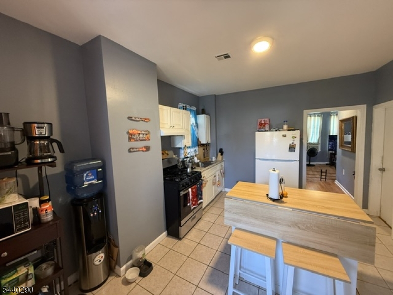 Beautifully maintained and renovated in 2024, this spacious 2-family home offers flexibility, comfort, and value. Delivered vacant at closing, the property features two well-appointed units, each offering a spacious eat-in kitchen, two generously sized bedrooms, a bright living room, and abundant natural light throughout.The home is in very good condition and move-in ready, with renovations completed in 2024 that enhance both comfort and overall appeal. A full basement with a private entrance offers additional potential, while the fenced backyard provides space for outdoor enjoyment and recreation.Additional features include forced-air heating, vinyl flooring, and modern kitchen amenities. Conveniently located near major highways, public transportation, shopping, schools, parks, and everyday services, with approximately a 25-minute commute to New York City.Seller concessions are available. Don't miss the opportunity to own this move-in-ready multi-family property in a convenient Irvington location..