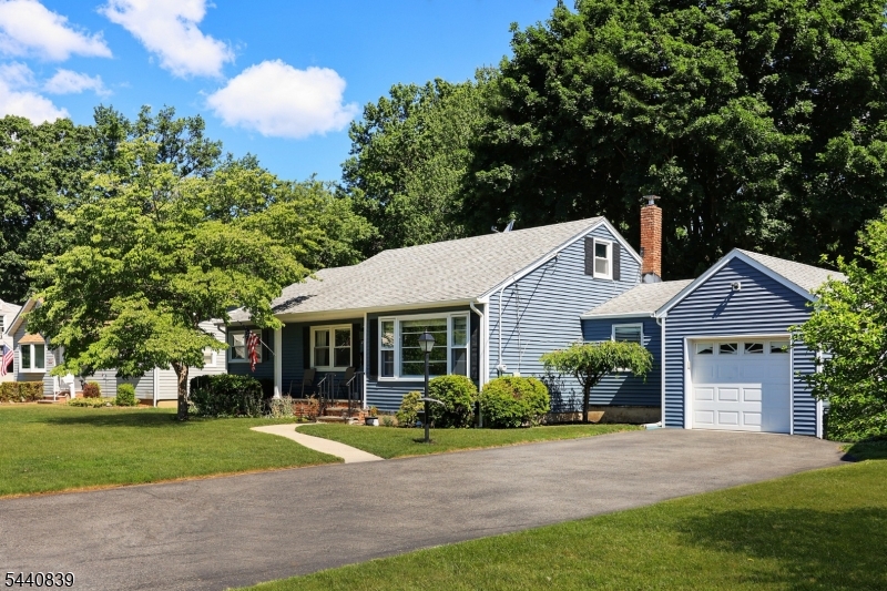 This beautiful 3-bedroom ranch has been beautifully maintained and updated. True, one-floor living.  A lovely, covered front porch leads you into the foyer and living room which is open to dining room. A family room has access to the garage and beautiful backyard.  The kitchen also opens to the back patio. Three bedrooms and a full bath and two large closets complete the first floor. The basement is very large, unfinished and has Bilko doors to the back yard. The backyard is like a park with two patios a fire pit and a shed and beautiful shade trees. Updates and special features include, Vinyl siding, gutters 2017. HWH 2024, Boiler, 2013. HW floors, thermal windows. The location is beautiful and centrally located for schools, transportation, shopping. Don't miss this one.
