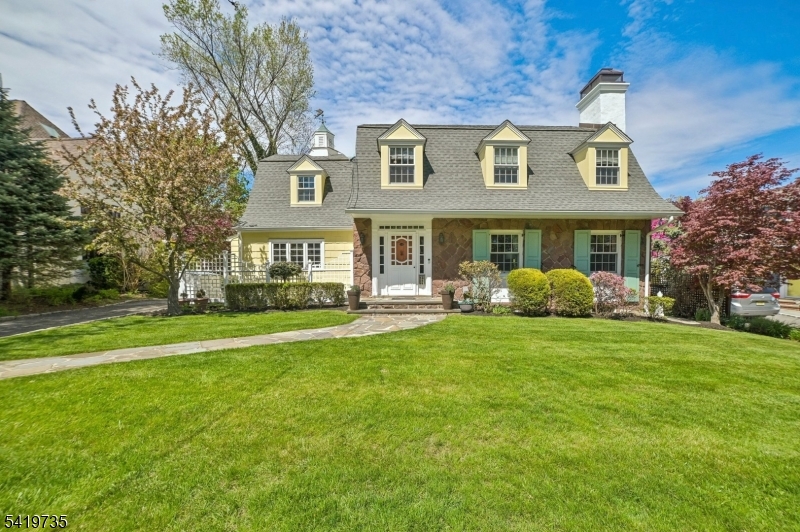 FABULOUS SHORT HILLS COLONIAL * PRIME  LOCATION. CLOSE TO TOWN, TRAIN & SCHOOL * Welcome to 11 Hawthorne Road, a spacious, fully renovated 4BR, 3.2BTH Colonial nestled on a quiet lane in the coveted Knollwood section of Short Hills. Classic architecture & modern amenities blend seamlessly to create a gracious & warm home. The main level features a welcoming foyer, stunning LR w/ wood burning FP, gracious DR w/ bay window & private home office w/ custom built-ins. The gorgeous eat-in kitchen/family room is the heart of the home, & features professional grade SS appliances, granite counters, marble clad island, step-down family room w/ breakfast nook & french doors to the yard. Upstairs find 4BR & 2.5BTH. The primary suite features a wall of custom closets & a private ensuite bath. 2 more BR share a hall BTH, while the 4th BR has its own half BTH. The finished lower level has a rec room, laundry, craft room, full BTH with steam shower and plenty of storage. Head outside to a gorgeous, level yard with open lawns, flowering trees, patio and 1-car garage built in 2017.  Upgrades include a newer roof and gutters, new windows in 2021and a charming cupola with cupid weathervane. All this in a fabulous Short Hills neighborhood where block parties, bike riding and trick-or-treating abound!  Welcome home!