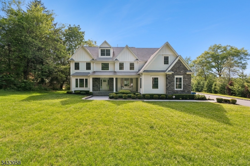 Nestled on a quiet street in desirable Berkeley Heights, this stunning 6-bedroom, 5.1-bath Center Hall Colonial beautifully blends elegance, comfort, and modern living. From the moment you enter the grand foyer, you're greeted by soaring ceilings, abundant natural light, and a timeless neutral palette that creates a warm and inviting atmosphere throughout the home. Thoughtfully designed for both everyday living and effortless entertaining, the main level offers a spacious dining room, formal living room, and an inviting family room that flows seamlessly into the beautifully appointed eat-in kitchen. Serving as the heart of the home, the kitchen features JennAir stainless steel appliances, striking two-tone cabinetry, and an oversized center island with seating for four. Just off the kitchen, step outside to your own private backyard retreat complete with a paver brick patio and cozy fire pit area   the perfect setting for relaxing evenings or entertaining year-round. Upstairs, you'll find five generously sized bedrooms, including the luxurious primary suite with walk-in closets, private sitting room, and a spa-like en-suite bath. A conveniently located 2nd floor laundry room adds ease and functionality. The finished basement expands the home's impressive living space, offering a bed/guest room, rec area, home gym, and even a private hair salon, providing everything you could wish for under one roof. This home has it all!!