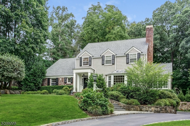 MAGNIFICENT RENOVATED COLONIAL * AMAZING OLD SHORT HILLS LOCATION * Impeccable home rests atop .92 acres of expansive property on the most exclusive street in Short Hills. With superior design by Rosen, Kelly Conway Architects this home offers every amenity for elegant & comfortable living. The 1st floor boasts a spacious LR, banquet sized DR, the ultimate gourmet kitchen w/ marble center isle, bar seating, Wolf 6-burner cooktop, Miele double wall oven, 2 Miele dishwashers & separate breakfast room. Sun drenched family room with gas fireplace totally opens to the kitchen. French doors to the patio offer easy indoor-outdoor entertaining. Private home office plus sunroom w/ vaulted ceiling round out the 1st floor. Upstairs find 5 bedrooms & 4 full baths including the deluxe primary suite w/ gas fireplace & spa-like bathroom w/ soaking tub, glass shower and double vanity. 4 more bedrooms & laundry room are also found on the 2nd and 3rd floors. Gorgeous lower level has full gym, newly carpeted rec room, mudroom w/ custom storage & 2-car attached garage.  Step outside & prepare to be wowed by private, estate-like property w/ extensive patios, bluestone walkways, park-like open lawns & manicured grounds. 86 Knollwood Road is an easy walk to everything: Short Hills train station (.5 mi.), Glenwood Elementary (.6 mi.), Hartshorn Arboretum (.5 mi.) & all that Short Hills-Millburn has to offer.  This is a rare opportunity to own a beautifully renovated home in a fabulous location.