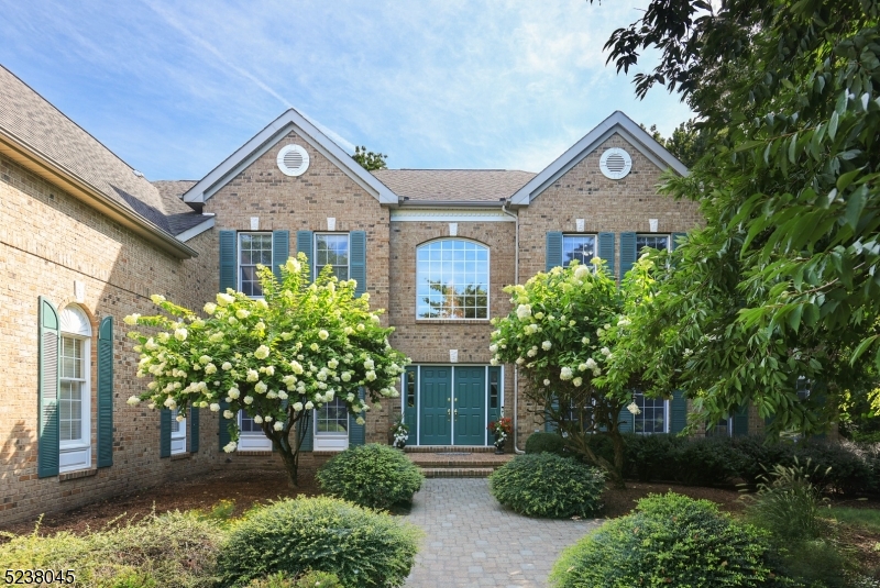 An amazing opportunity to own a classic brick front colonial featuring 6 spacious bedrooms(including a 1st floor bedroom and en-suite bath), 5.1 baths, with a park-like backyard on 1.5 acres in the Canterbury Estates, one of the most coveted neighborhoods in Basking Ridge. The first floor boasts a soaring 2 story foyer with an open floor plan.  The gourmet kitchen(SS appliances including 2 dishwashers, center island, granite countertops and sizable pantry) with a breakfast area opening up to a 2 story family room with window lined walls and a floor to ceiling brick gas fireplace. The conservatory with sweeping views of the property has a door leading to the breathtaking backyard and paved patio. Other rooms include the office with custom built-in bookshelves, living room, dining room with fine millwork, butlers pantry and updated half bath. The second floor boasts a renovated(2023) luxurious primary bedroom suite including a spa-like bathroom with heated flooring, sitting room/office, abundant closet space, and 2 spacious bedrooms with en-suite baths, as well as two other bedrooms that share a Jack and Jill bath.  The expansive basement can be used as a recreational area and has a walk-out entrance to one of the largest, flat back yards on Canterbury. This home is an oasis for relaxation and entertainment! There is a  GENERAC whole house back-up generator. This home is in an ideal location close to highways, airport, parks and Liberty Corner Elementary School.