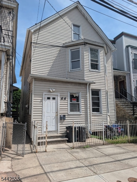 Great investment opportunity! This 2-family property offers plenty of potential and is conveniently located close to shopping, schools, public transportation, and major highways. The first-floor unit features 3 bedrooms, 1 full bathroom, a living room, and an eat-in kitchen. The second-floor unit offers 2 bedrooms, 1 full bathroom, a living room, and an eat-in kitchen. The finished third level includes a studio with a full bathroom, providing additional finished living space.  The property is currently vacant and ready for its next owner. Being sold strictly as is. The home needs TLC, making it an excellent opportunity for investors or owner-occupants looking to add their personal touch. No basement.