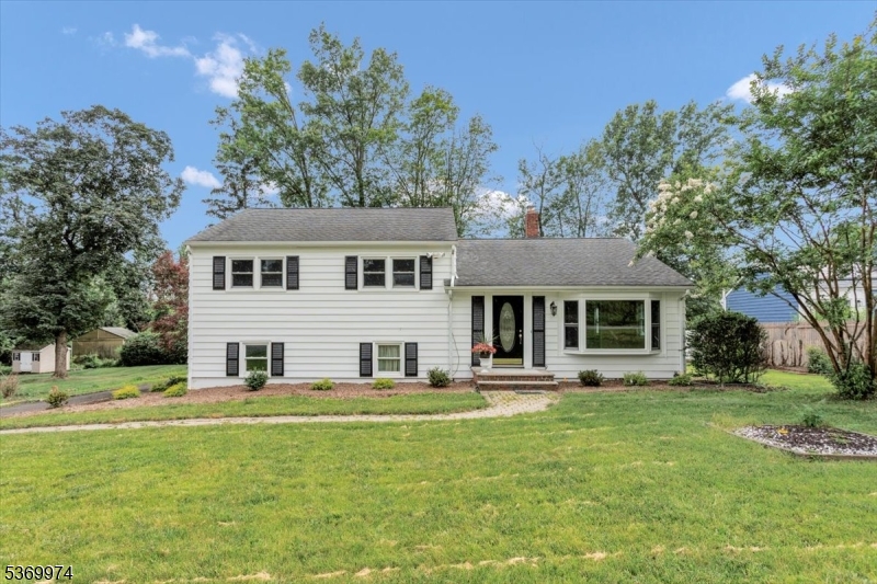 Renovated single family home with wonderful updated kitchen and bathrooms. The modern kitchen is equipped with stainless steel appliances, granite countertops, a tile backsplash, a breakfast bar, and a spacious dining area. A door from the kitchen opens to a deck and a private backyard with a pond less waterfall feature ideal for entertaining or relaxing. The driveway leads to a deep one-car garage with additional parking for 2 to 3 cars and ample space to turn around. Located in the desirable Normandy Park neighborhood, this split-level home includes three bedrooms and two full baths. The living room Boasts hardwood flooring, while the bedrooms are carpeted over hardwood. On the ground level, is a large family room with a full bathroom. Direct access to the driveway offers flexible use as a guest suite. The laundry/mud room with washer/dryer hookups is also on this level. A finished recreation room on the basement level adds additional living or play or work from home space. Enjoy easy access to both the Convent and Morristown train stations, as well as Routes 24, 78, and 287 for convenient commuting. Home is part of the Green Knolls, Featherleigh, Normandy Parkway neighborhood Watch community. This home is also close to top amenities: dining, golf, fine arts, Morristown Medical Center, Newark Airport, and NJ Transit. It's truly a rare find with space, style, and convenience. Don't miss your chance to Call this home yours!