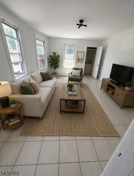 Welcome to this bright and inviting second floor apartment which offers a perfect blend of comfort and convenience.  It features 2 spacious bedrooms and 1 full bathroom.  Large windows throughout the apartment fill the space with an abundance of natural lighting, creating a warm and welcoming atmosphere in every room.  This comfortable layout provides ample living space, making it ideal for those seeking a cozy place to call home.  Conveniently located near shopping, dining, public transportation, and major roadways.  This apartment offers easy access to everything you need.Don't miss the opportunity to make this sun-filled apartment your next home!