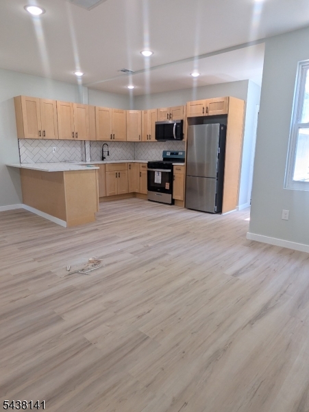 Spacious newly renovated unit featuring modern upgrades throughout! This beautiful home offers brand-new plumbing, electrical, central A/C, flooring, and a completely updated bathroom. The stylish kitchen is equipped with all stainless steel appliances, granite countertops, and a center island perfect for cooking and entertaining. Enjoy large bedrooms with ample space and natural light throughout the home. Laundry hook-up available in basement for additional fee. Conveniently located near schools, houses of worship, public transportation, major highways, and just minutes from downtown Newark. A perfect blend of comfort, style, and convenience!