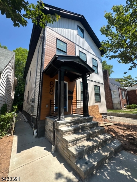 Welcome to this beautifully renovated, brand-new 2-bedroom, 2-bath rental featuring a full gut renovation with modern finishes throughout. This bright and spacious apartment offers an open-concept living, dining, and kitchen area. Everything is brand new, including the kitchen, bathrooms, flooring, fixtures, and appliances. The primary bedroom includes a private en-suite bathroom. Additional features include in-unit laundry, full driveway parking, and access to the backyard. A clean, modern, move-in-ready rental with the convenience and comfort you've been looking for.