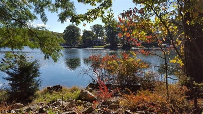 Rare 0.26-Acre Buildable Lakefront Lot on Lake Hopatcong. Gorgeous Views, on no-wake zone with calm waters for your boat. Build your lakefront dream home on this beautiful private property. This Large Irregular Double-Lot offers over 90 ft of lake frontage, plus a driveway down to the lake level. Come enjoy all the activities on Lake Hopatcong, the largest freshwater lake in New Jersey, just 75 miles from NYC. Activities include Swimming, Boating, Fishing plus many lakefront gourmet restaurants. NJ Transit Lake Hopatcong Train Station is just 3 miles away, making for an easy 1-hour commute to NYC. Preliminary Building Plans is available but it is the Buyer's responsibility to get Certified Architectural Plans and all Zoning Approvals and Permits.
